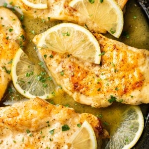 closeup of a skillet with honey lemon chicken