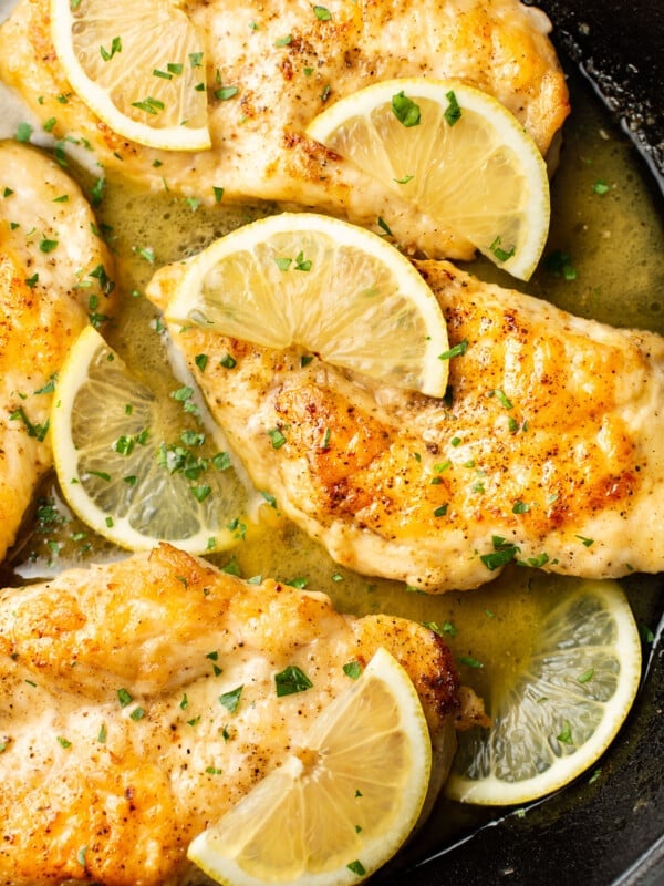 closeup of a skillet with honey lemon chicken