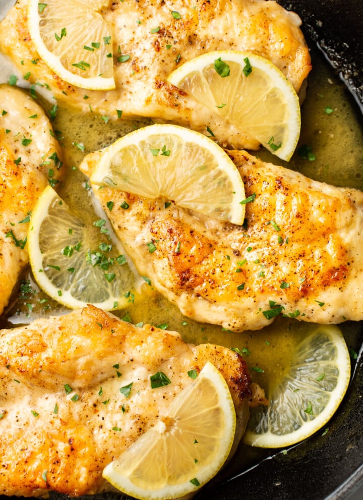 closeup of a skillet with honey lemon chicken