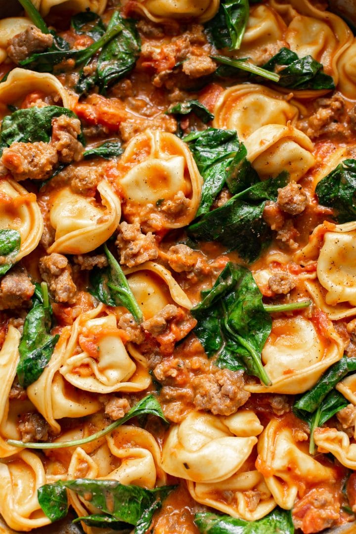 close-up of tortellini with spinach and sausage