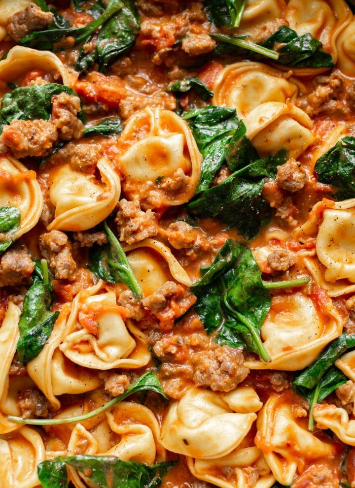 close-up of tortellini with spinach and sausage