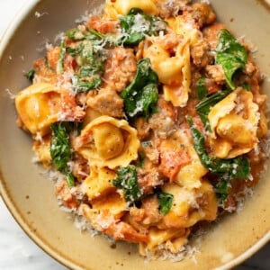 a bowl of italian sausage tortellini