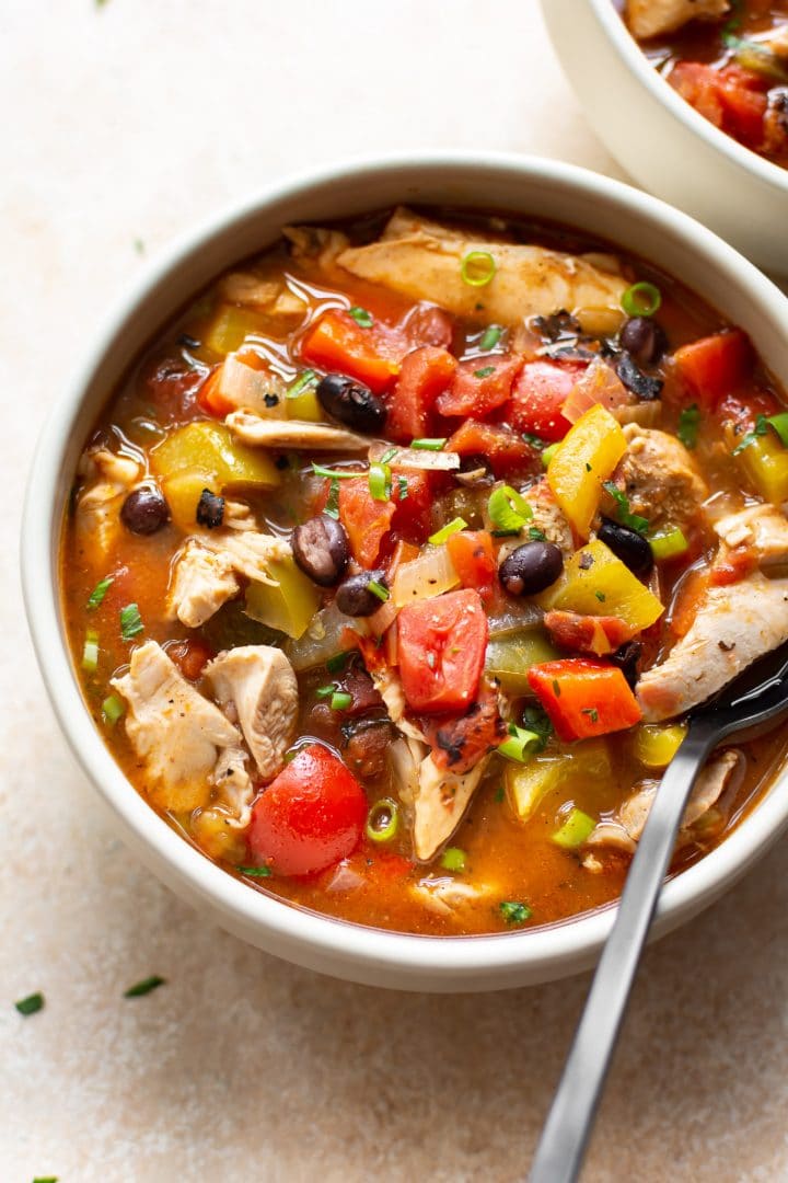 easy chicken fajita soup in two white bowls