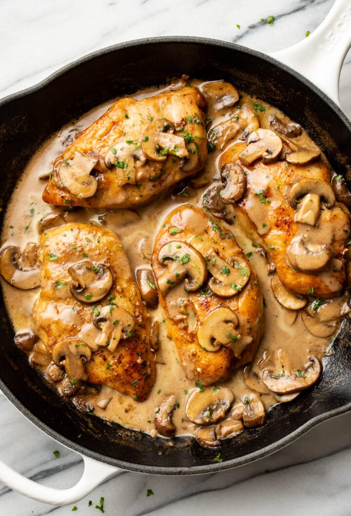 a cast iron skillet with chicken marsala