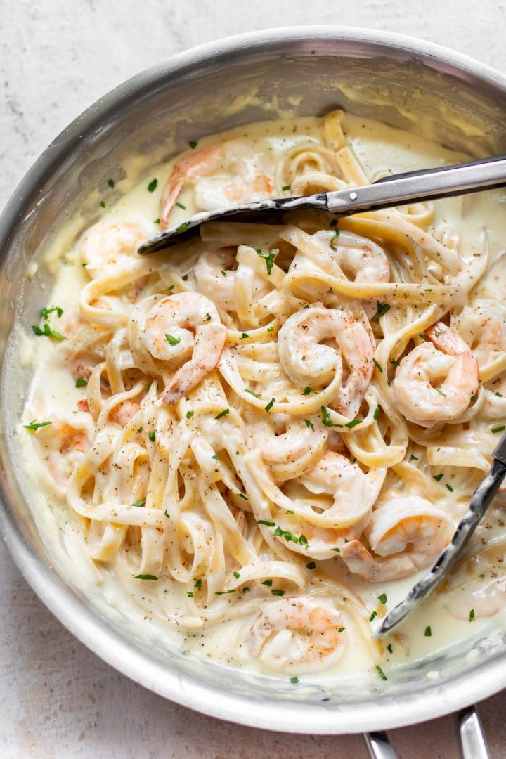 creamy shrimp alfredo pasta in a skillet