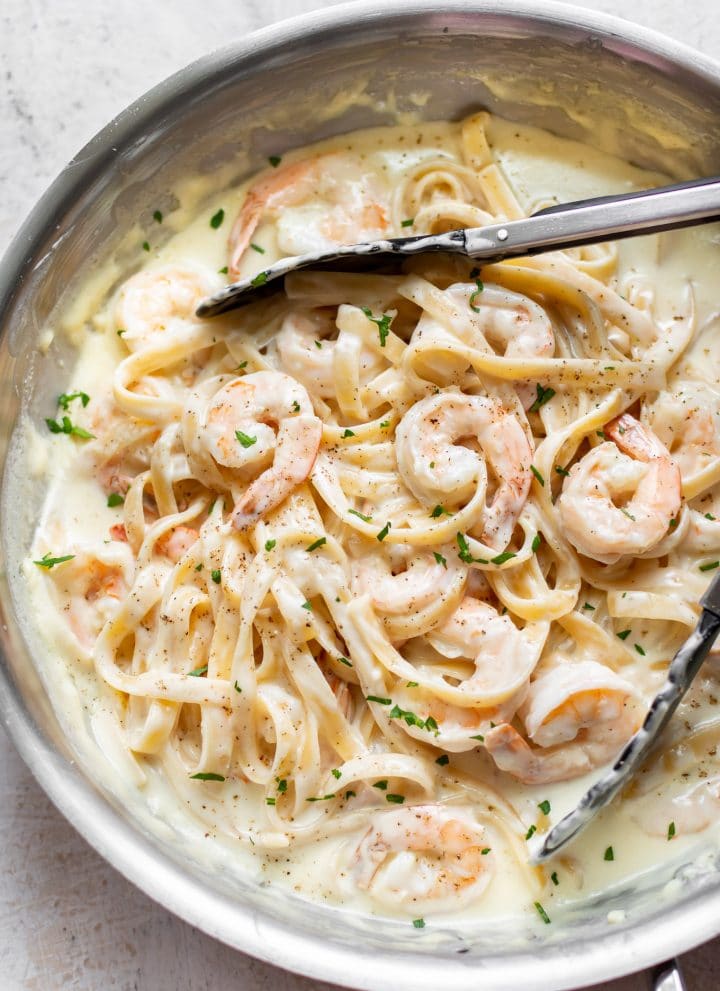 creamy shrimp alfredo pasta in a skillet