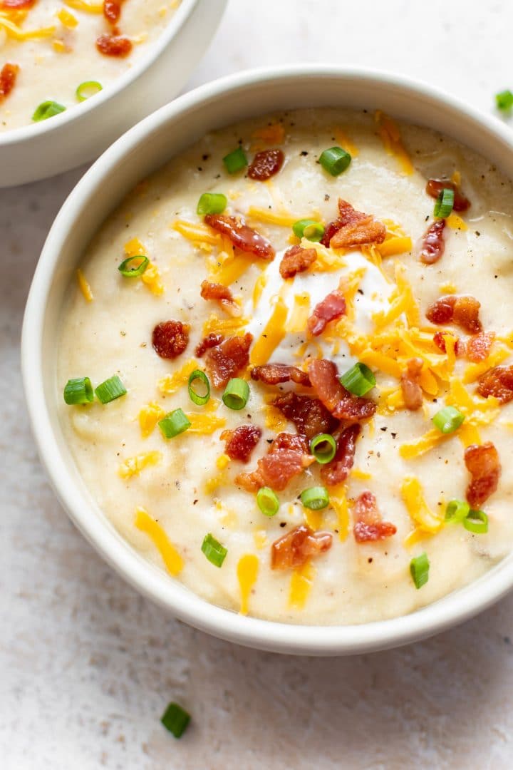 loaded baked potato soup in two bowls