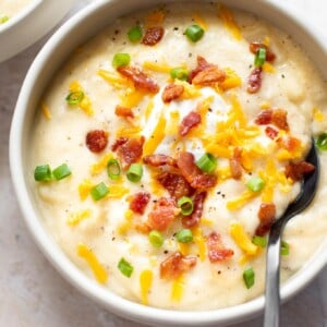 creamy loaded baked potato soup with a spoon