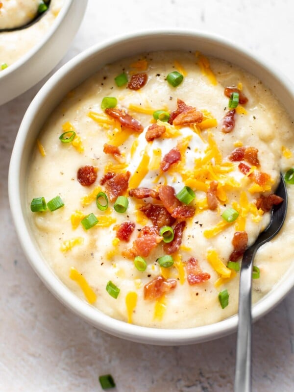 creamy loaded baked potato soup with a spoon