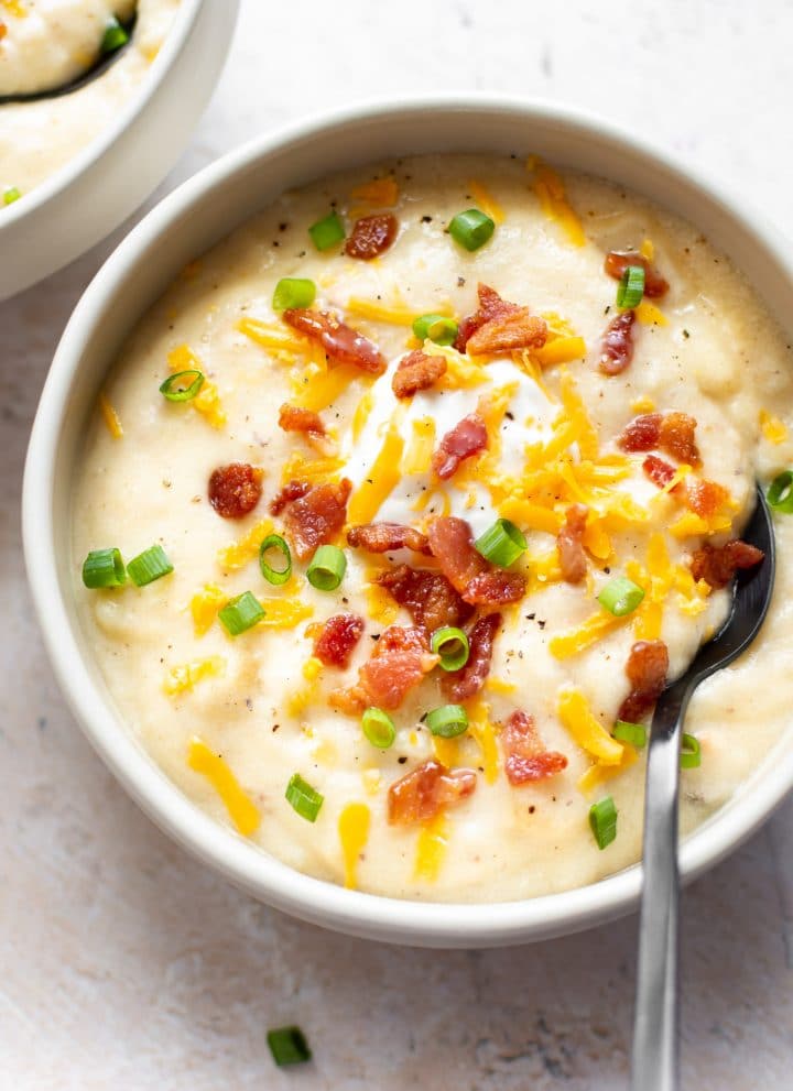 creamy loaded baked potato soup with a spoon