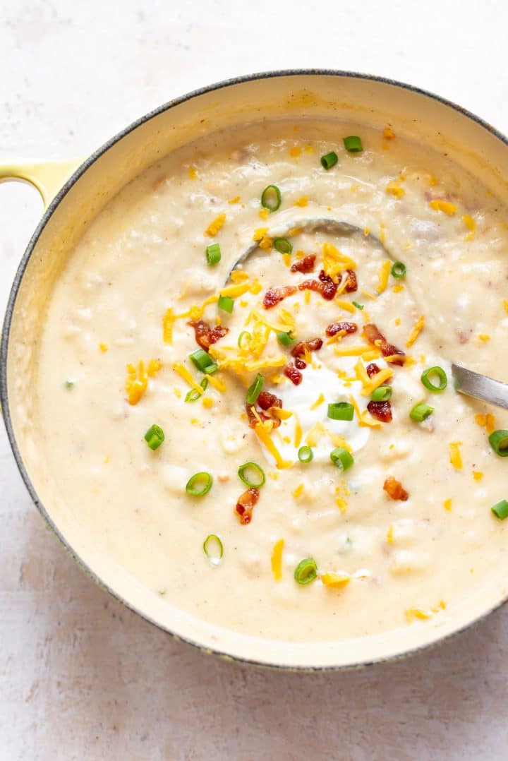 the best baked potato soup in a yellow pot