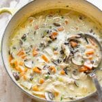 creamy turkey wild rice soup in a yellow soup pot