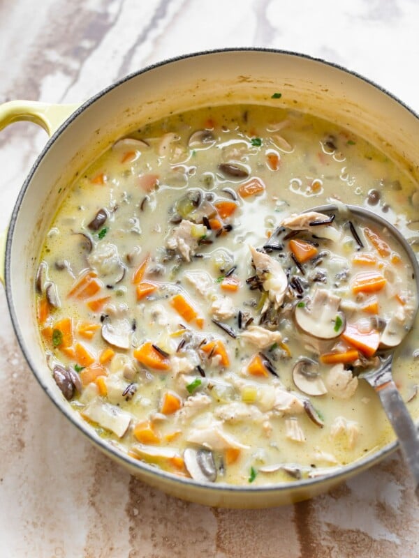 creamy turkey wild rice soup in a yellow soup pot