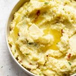 closeup of creamy ranch mashed potatoes with melted butter on top