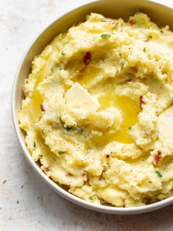 closeup of creamy ranch mashed potatoes with melted butter on top