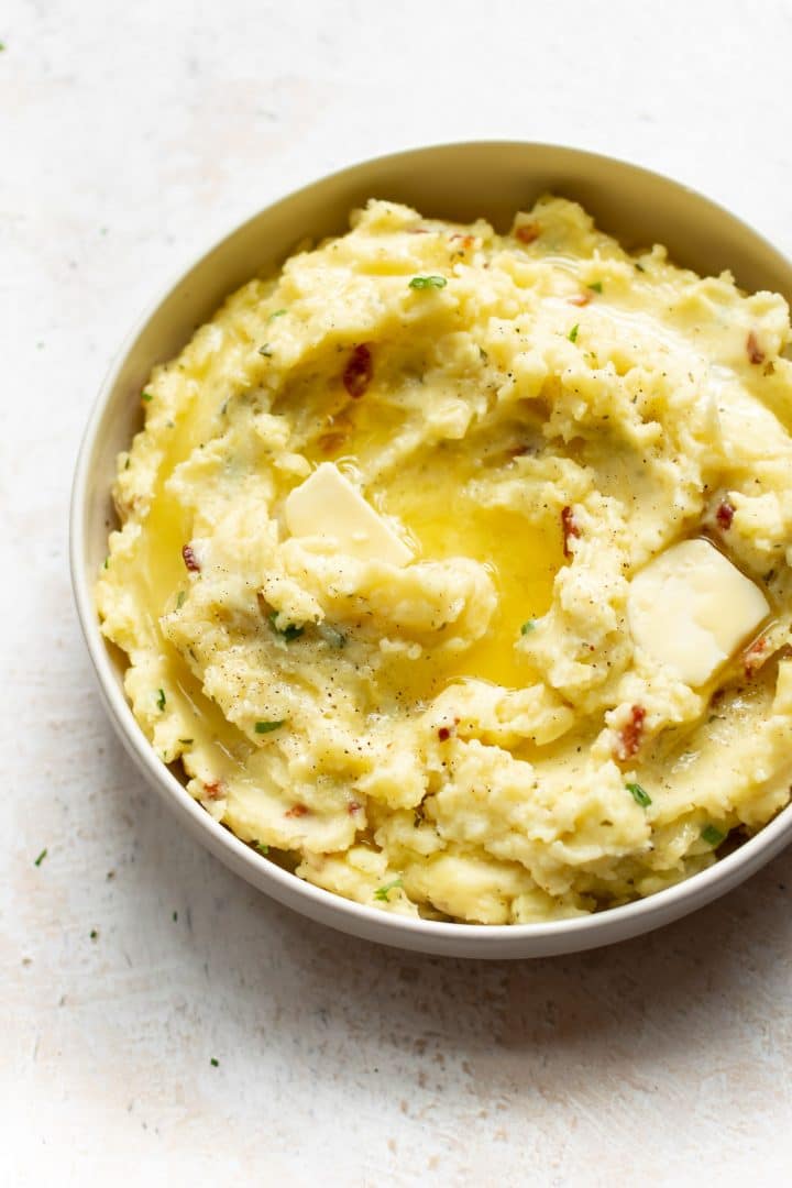 ranch bacon mashed potatoes with scallions and butter on top