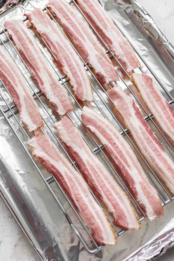 raw bacon on a wire rack (about to be cooked in the oven)