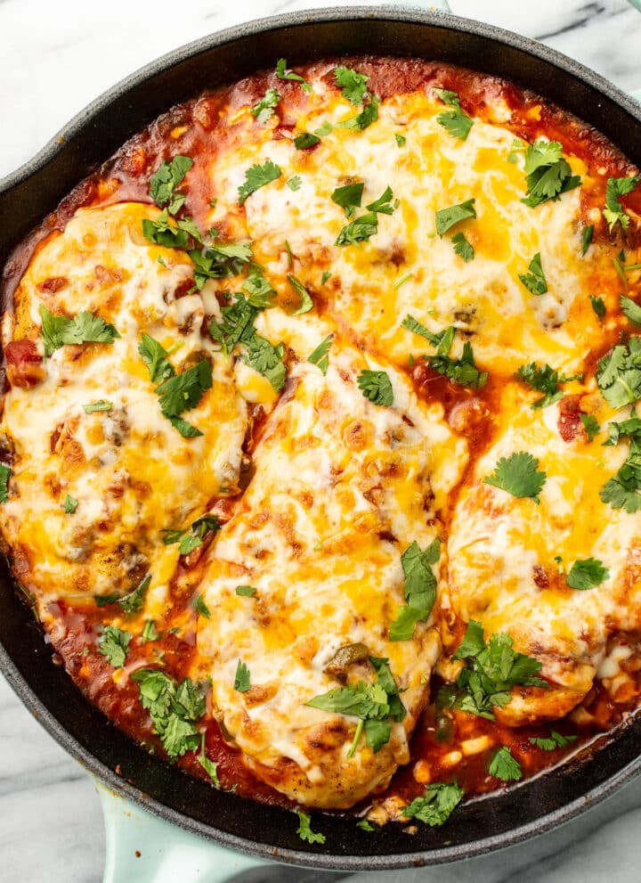 a skillet with salsa chicken