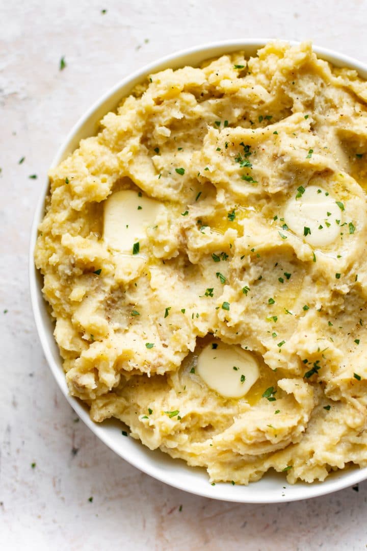 the best slow cooker mashed potatoes in a white bowl