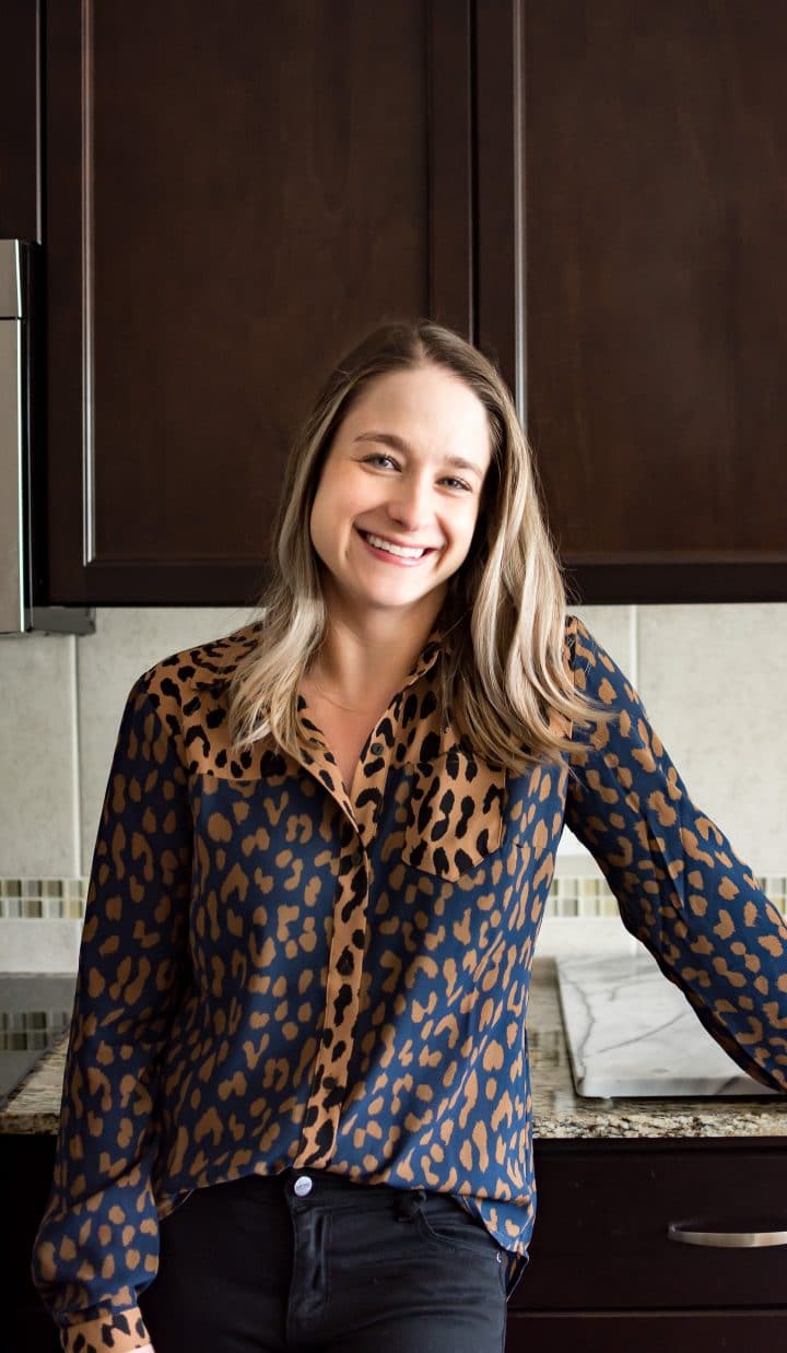 Natasha Bull of the food blog Salt & Lavender standing in her clean kitchen.