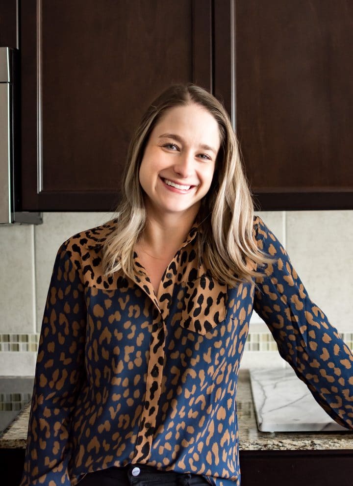 Natasha Bull of the food blog Salt & Lavender standing in her clean kitchen.