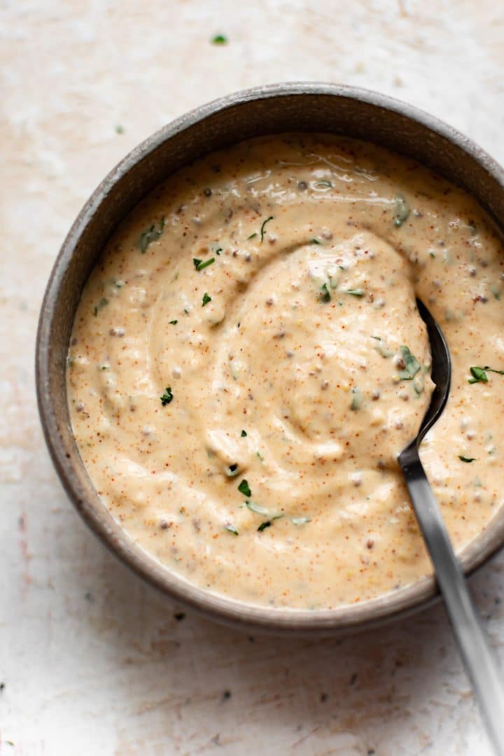 Louisiana remoulade sauce in a bowl with a spoon