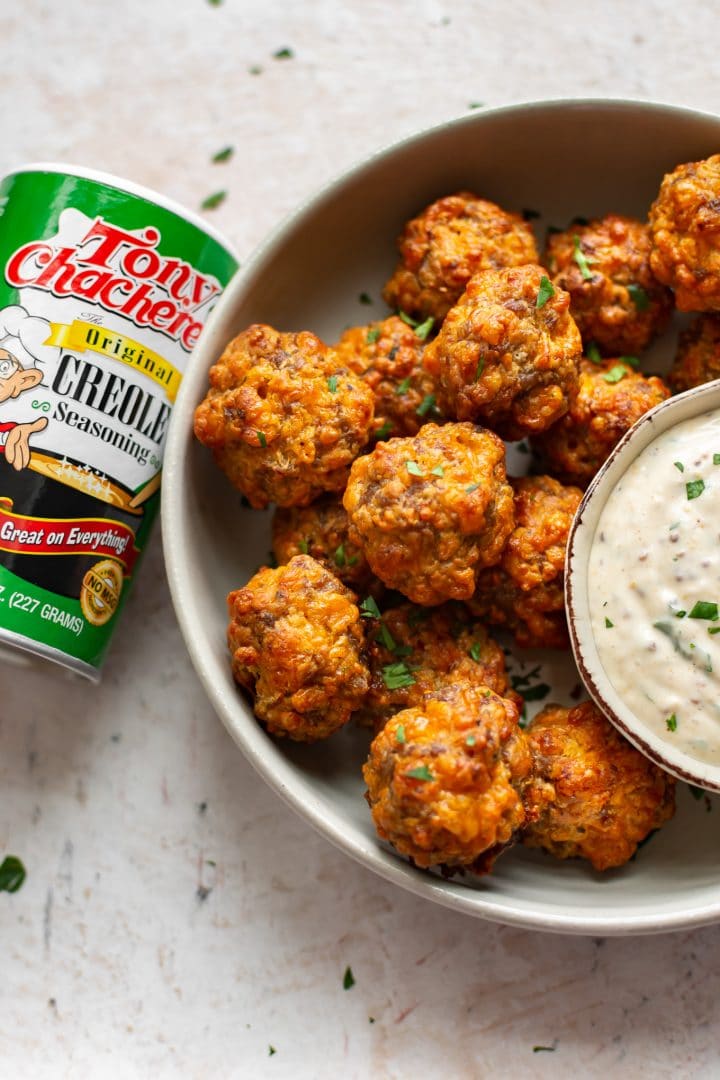 Creole sausage balls pictured with Tony Chachere's Original Creole Seasoning