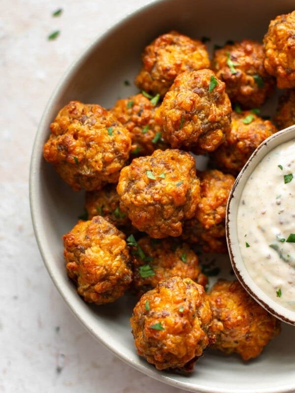 close-up of Bisquick sausage balls with remoulade dipping sauce