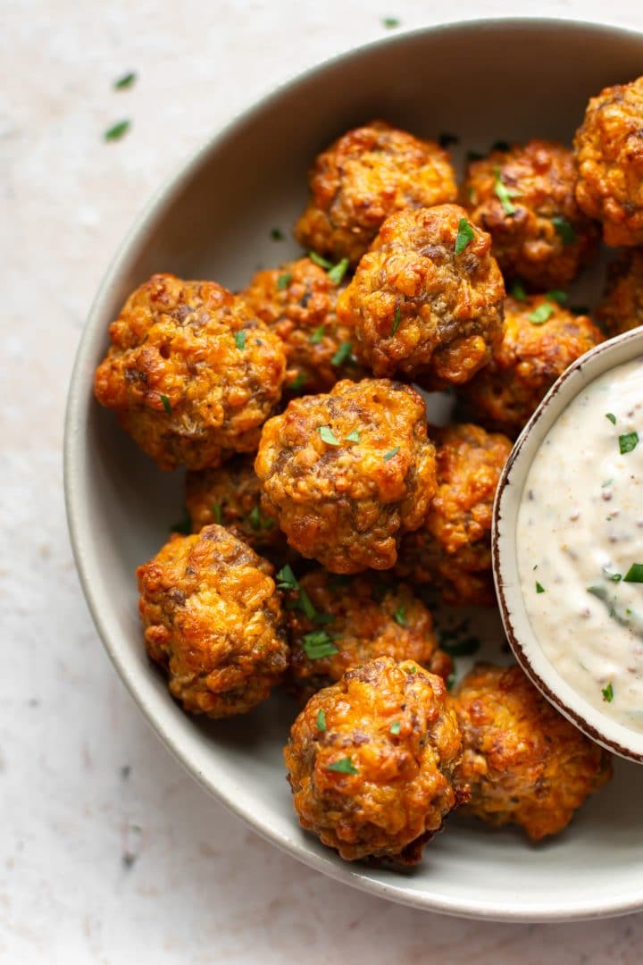 close-up of Bisquick sausage balls with remoulade dipping sauce