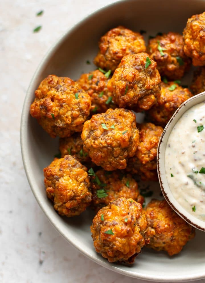 close-up of Bisquick sausage balls with remoulade dipping sauce