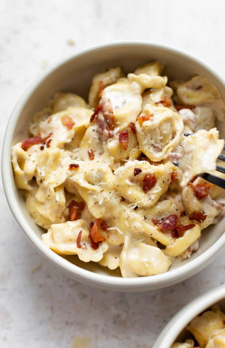 bacon cream cheese tortellini in two bowls