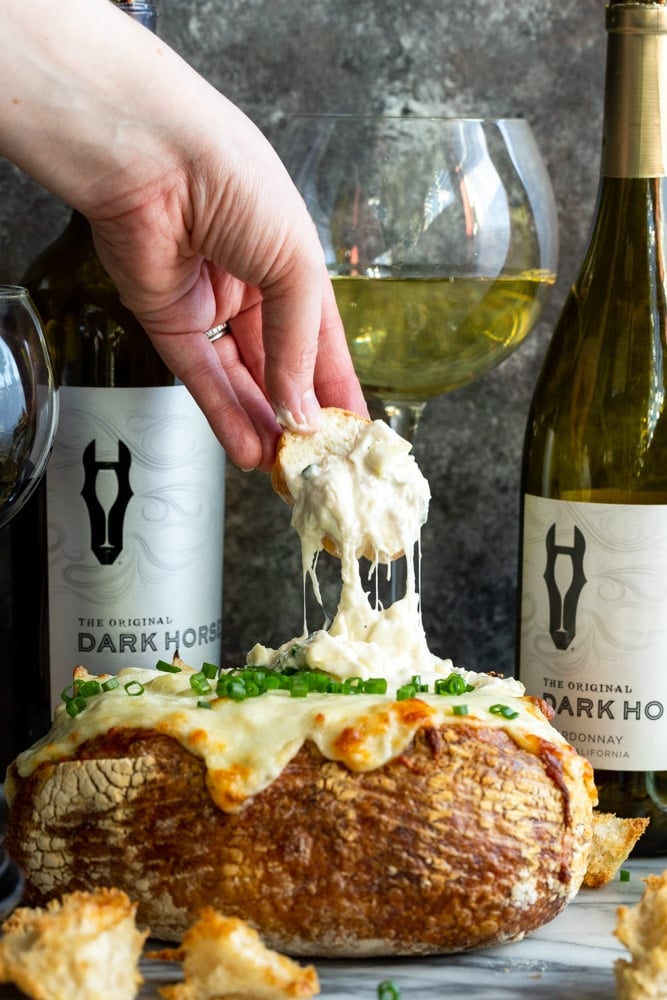 crab artichoke dip in a bread bowl