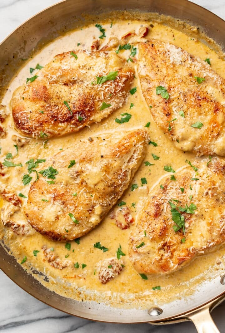 a skillet with creamy cajun chicken