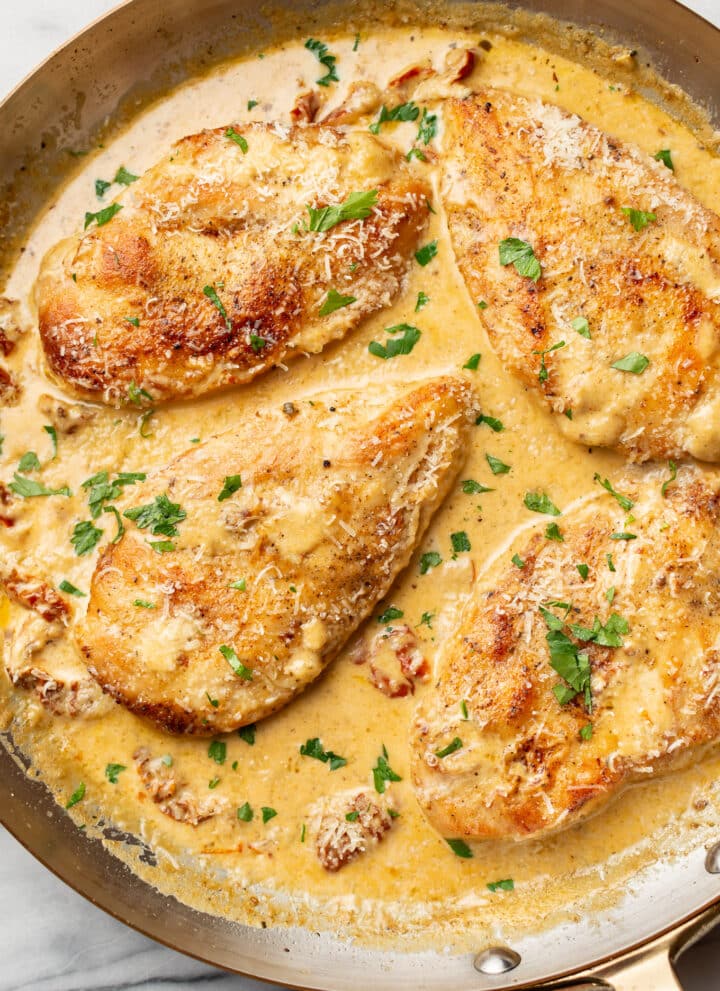 a skillet with creamy cajun chicken