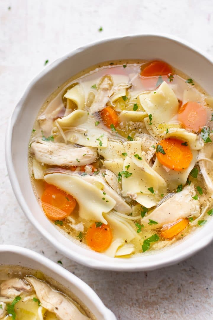 slow cooker chicken noodle soup in two bowls