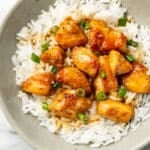 a bowl of honey chicken with jasmine rice