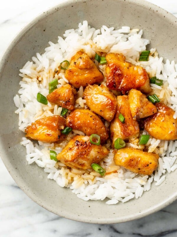 a bowl of honey chicken with jasmine rice
