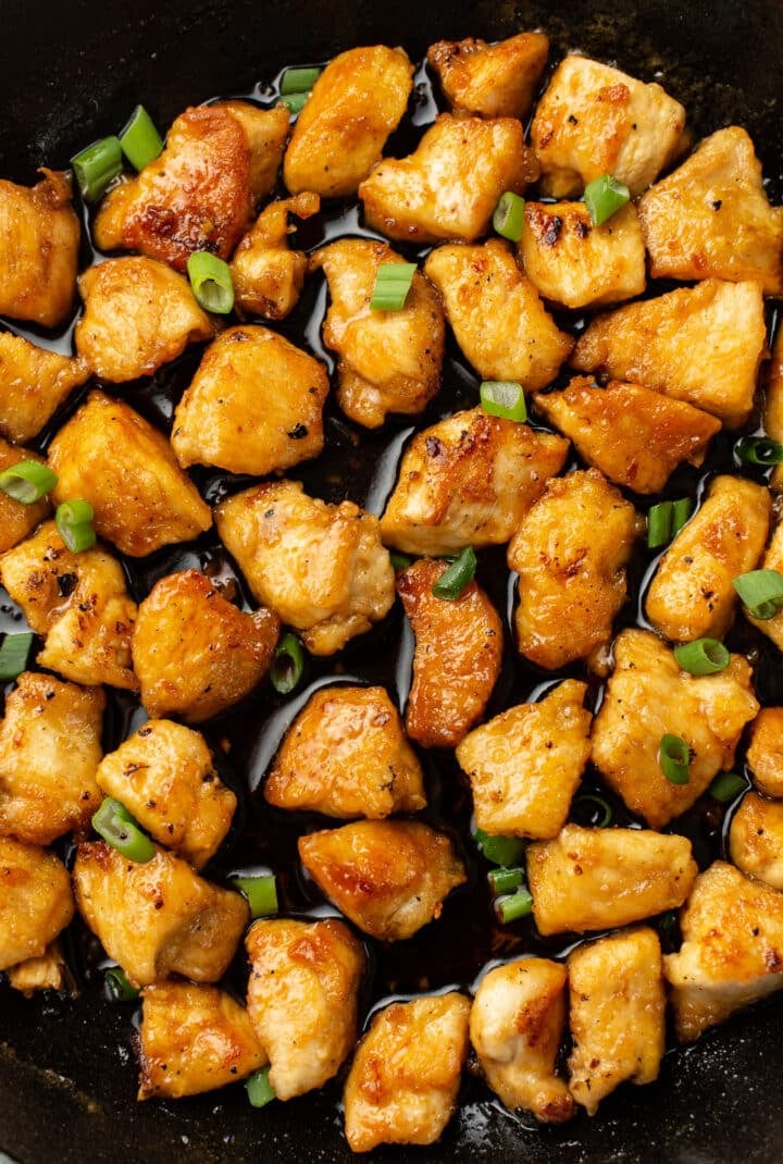 closeup of a skillet with pieces of honey chicken