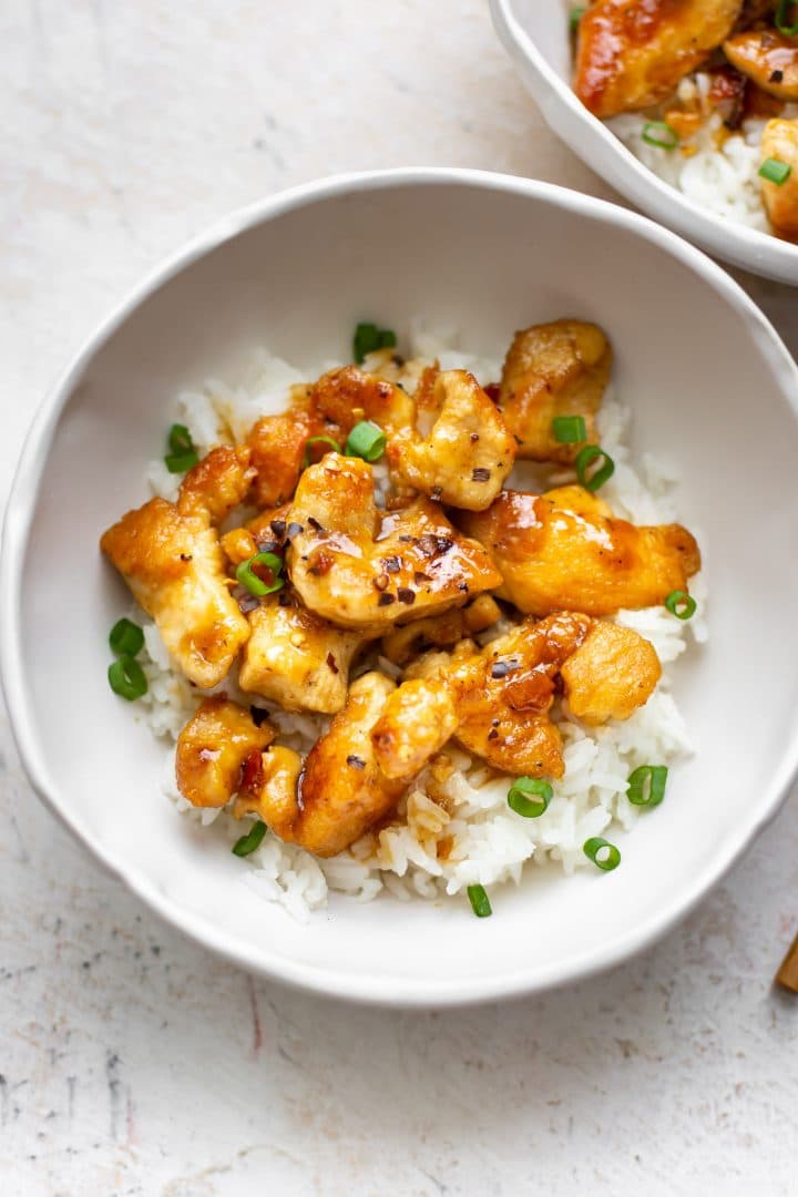 honey chicken in two white bowls