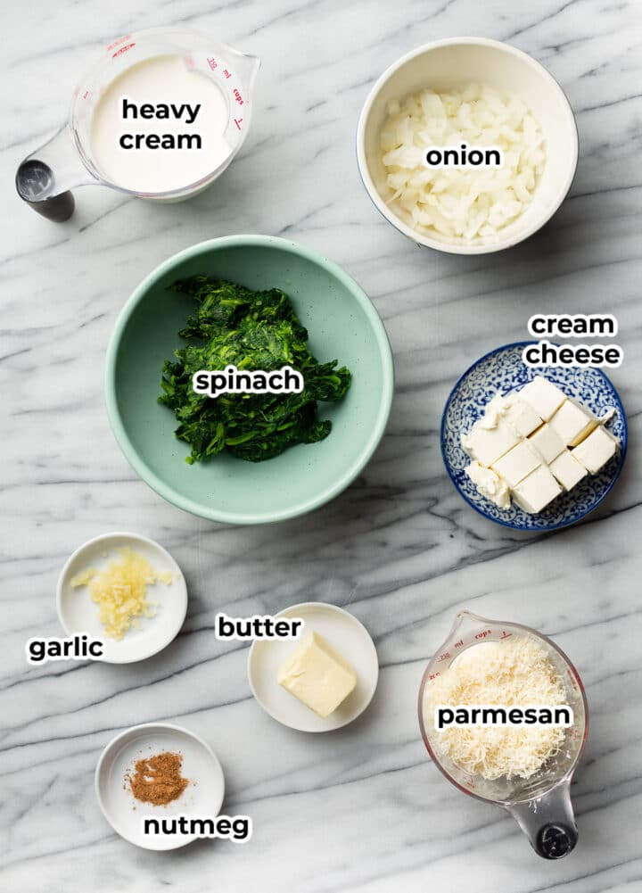 ingredients for creamed spinach in prep bowls