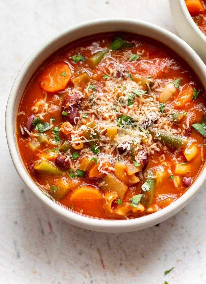 Italian minestrone soup in a white bowl