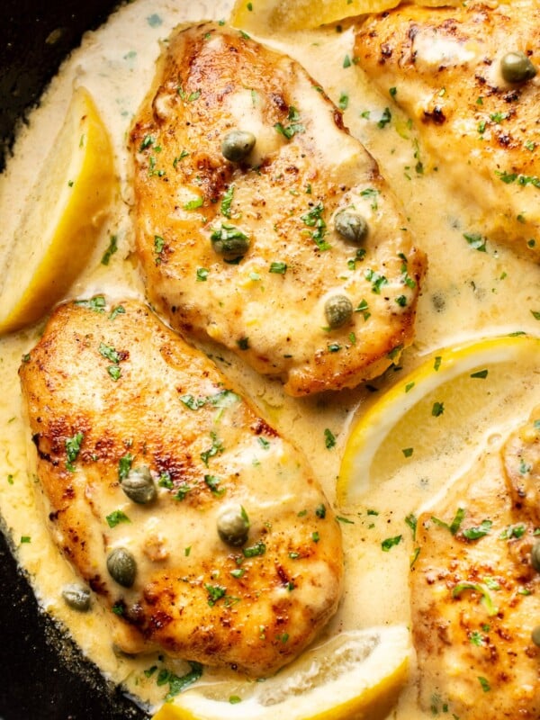 close-up of chicken piccata in a cast iron skillet