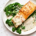 creamy dill salmon plated with broccolini and lots of sauce
