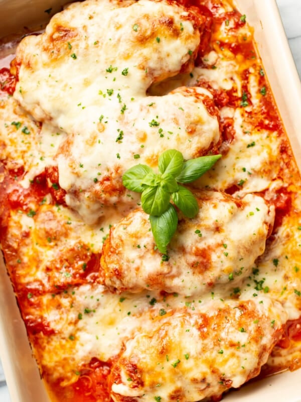 a casserole dish with cheesy mozzarella chicken