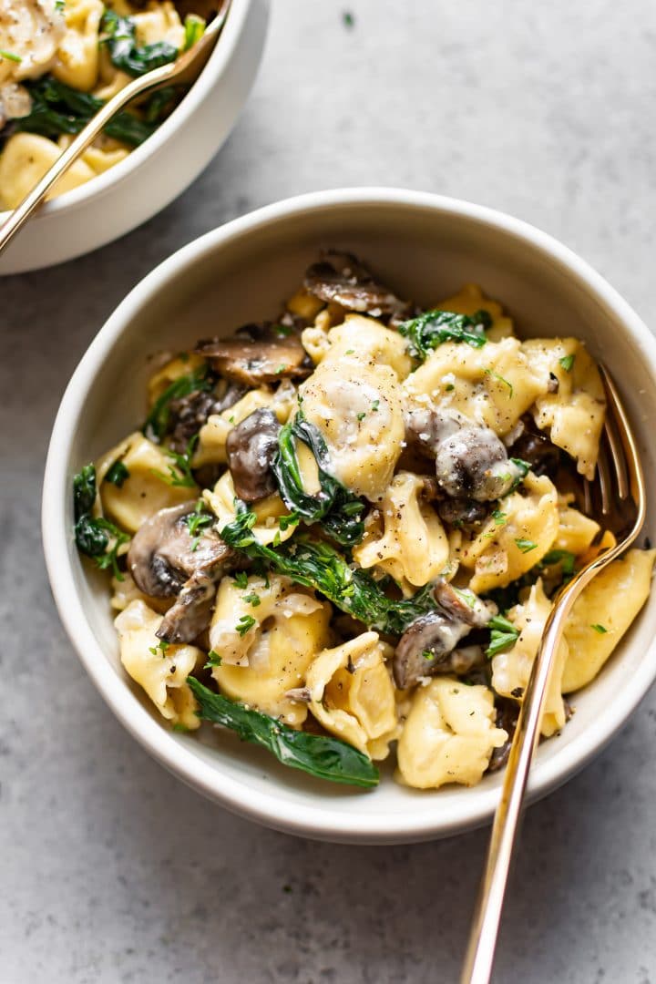 two bowls with creamy tortellini