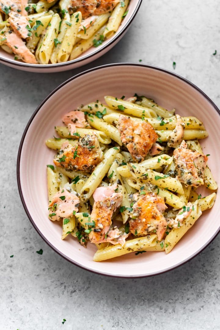 basil pesto salmon pasta in two bowls