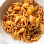 a bowl of creamy beef and shells pasta