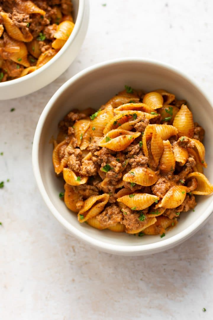 easy creamy beef and shells in two bowls