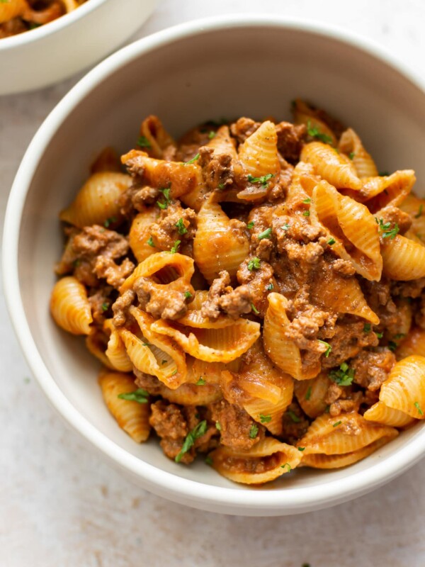 close-up of creamy ground beef and shells in a bowl