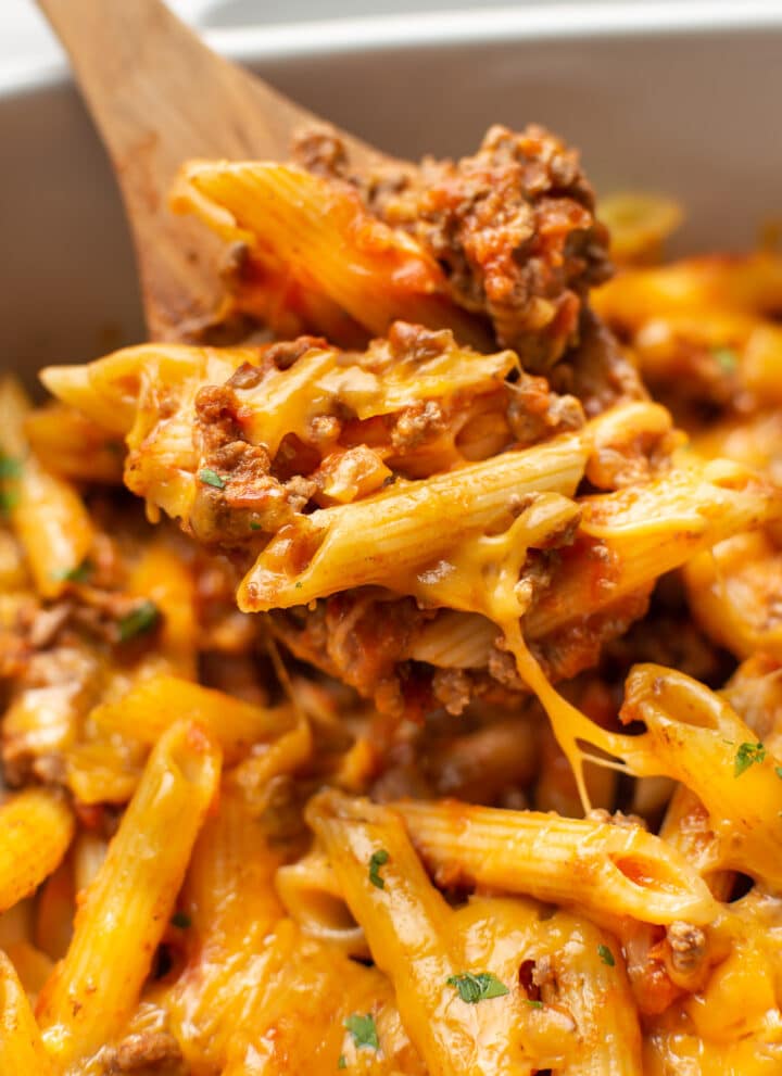 a serving spoon with ground beef casserole